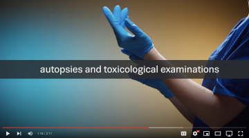 video cover — shows a doctor wearing blue gloves about to perform an autopsy